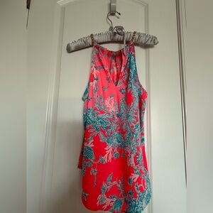 Lilly Pulitzer Cabana Halter Shelly Bat Coral Spritz with gold colored chain.